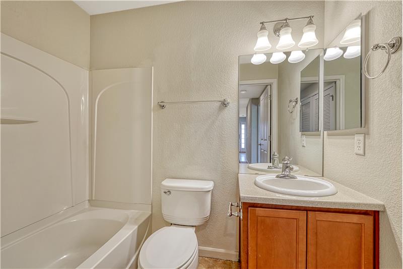 Full bathroom on entry level to townhome and by Bedroom #3, great for guests!