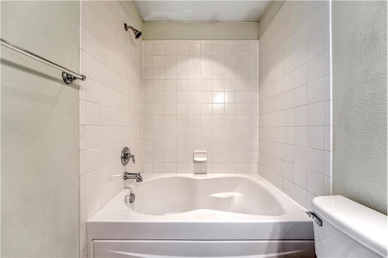 Adjoining bath to Primary Bedroom #2 with soaking tub!