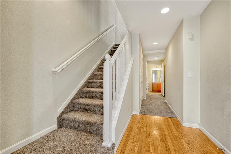 Entry with hardwood flooring & space for mud bench/great drop zone area