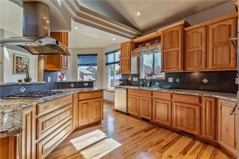 Kitchen has high-end appliances including gas cooktop and GE Monogram hood