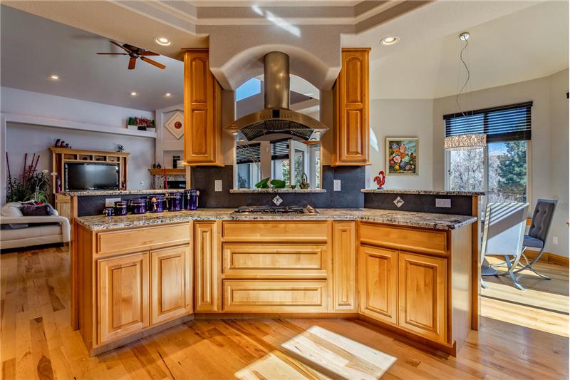 Kitchen island with cooktop and hood