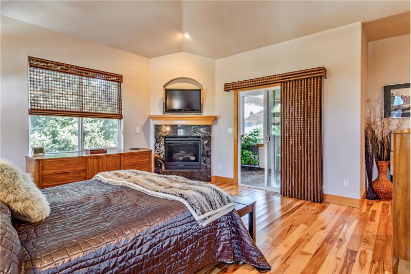 Master bedroom opens to sunroom and covered deck