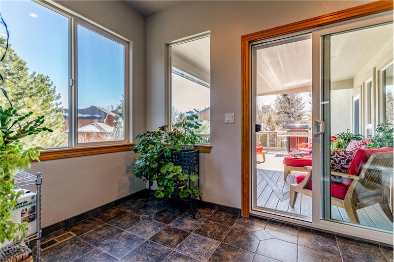 Sunroom between master bedroom and cover deck has a hose bib for a hot tub