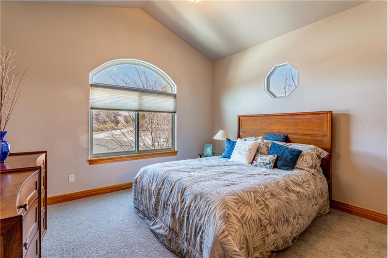Guest bedroom has vaulted ceiling too!