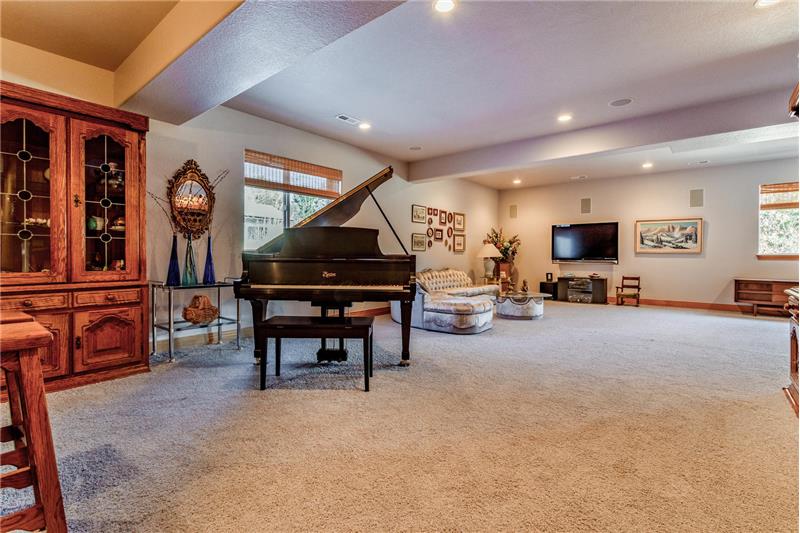 View of basement family room from wet bar