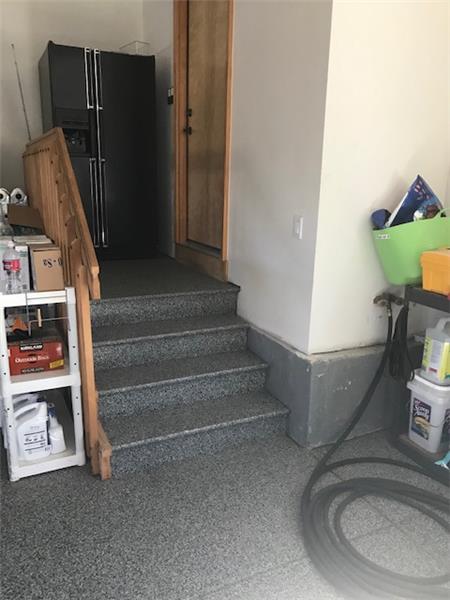 Garaged floor is epoxied -- even the steps! Hot & cold water hose bib too!