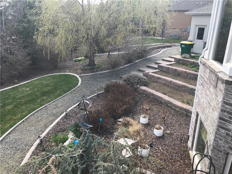 View of side yard from covered deck