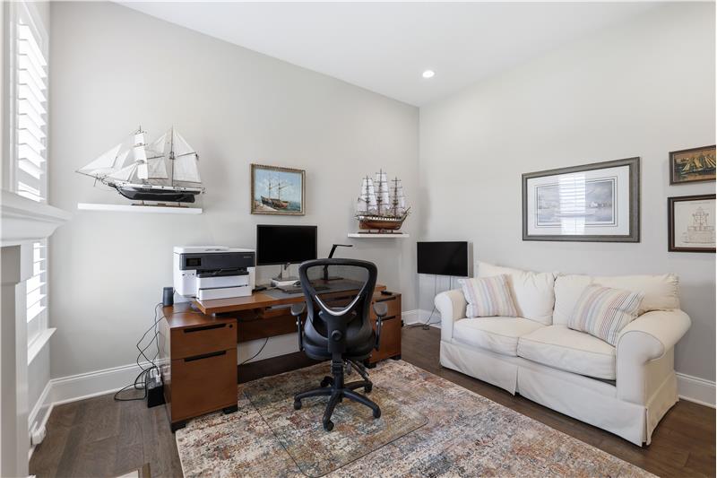 Front room is excellent flex space. Use it as a den, library, TV, living or music room. Double glass doors provide privacy.