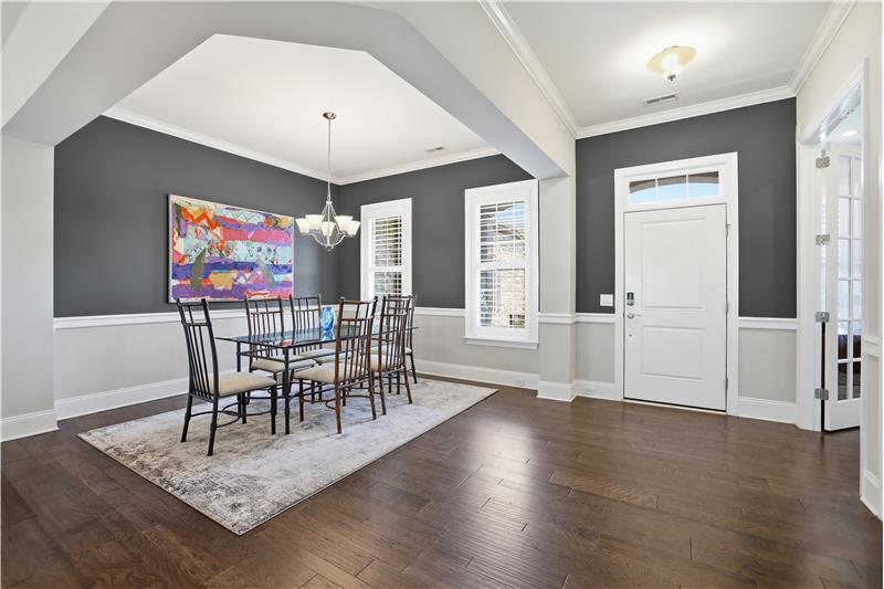 High ceiling, rich hardwood floors, crown molding, custom paint in entry create a warm, yet sophisticated first impression.