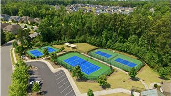 View of tennis and pickleball courts at Regency at Palisades. You'll also find a fitness center, billiards