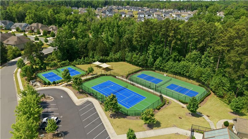 View of tennis and pickleball courts at Regency at Palisades. You'll also find a fitness center, billiards
