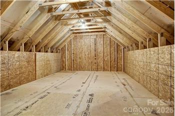 Large, walk-in attic storage over the garage is a special feature of this home.