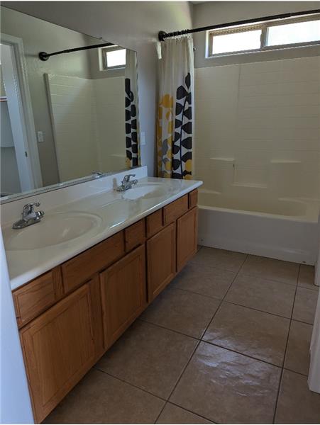Master bath with tub-shower, walk-in closet