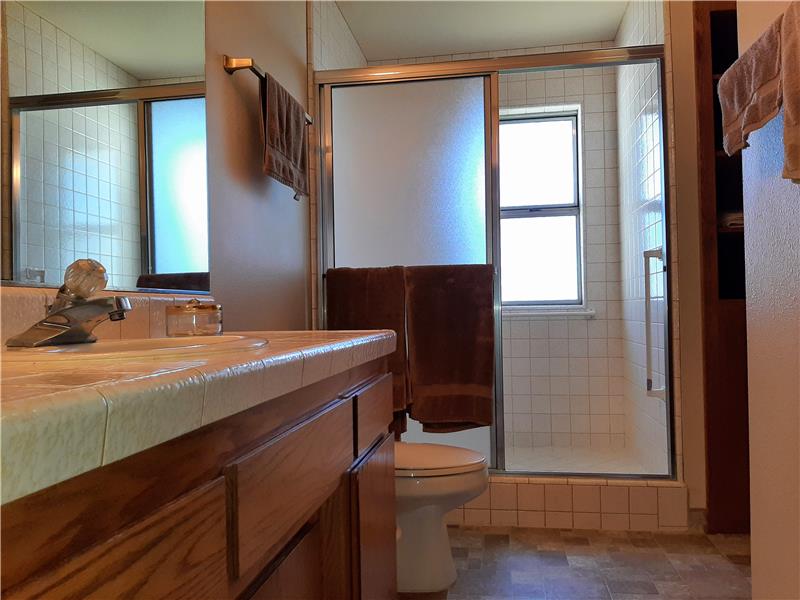 Main Bathroom features a low threshold step-in shower as well as grab bars! Oversized Shower is always a Plus!!