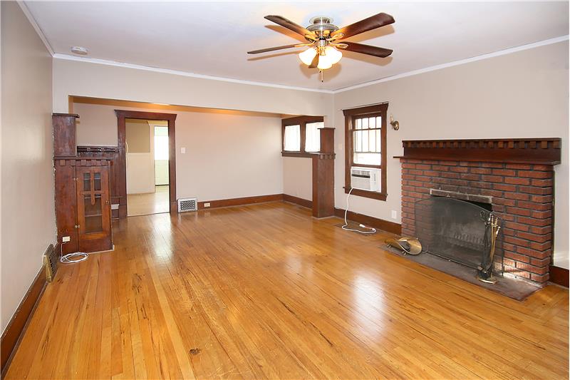 Living room with hardwood flooring and new paint