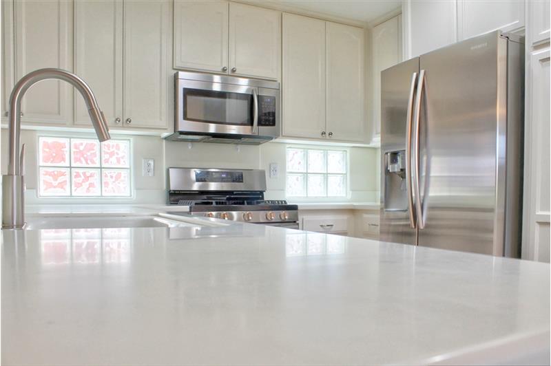 Solid Surface Counters in Kitchen and Bath. Smart!