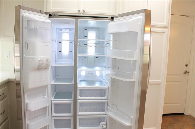 (this refrigerator is bigger than my first apartment)