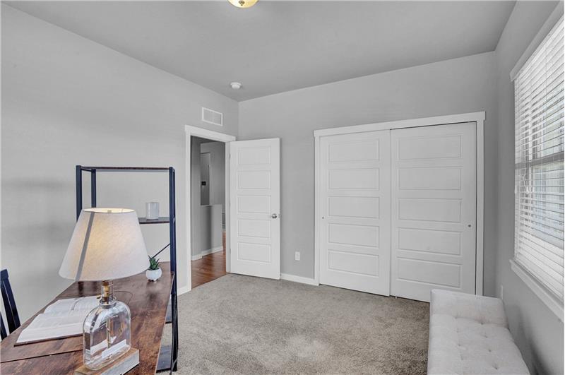 The Front Bedroom has neutral carpet and a generous closet