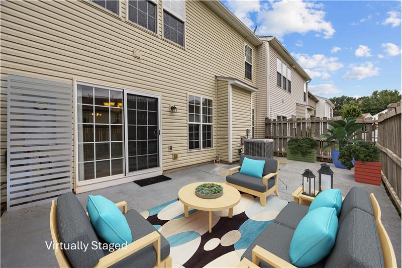 Fenced patio provides a private spot for morning coffee or unwinding at the end of the day.