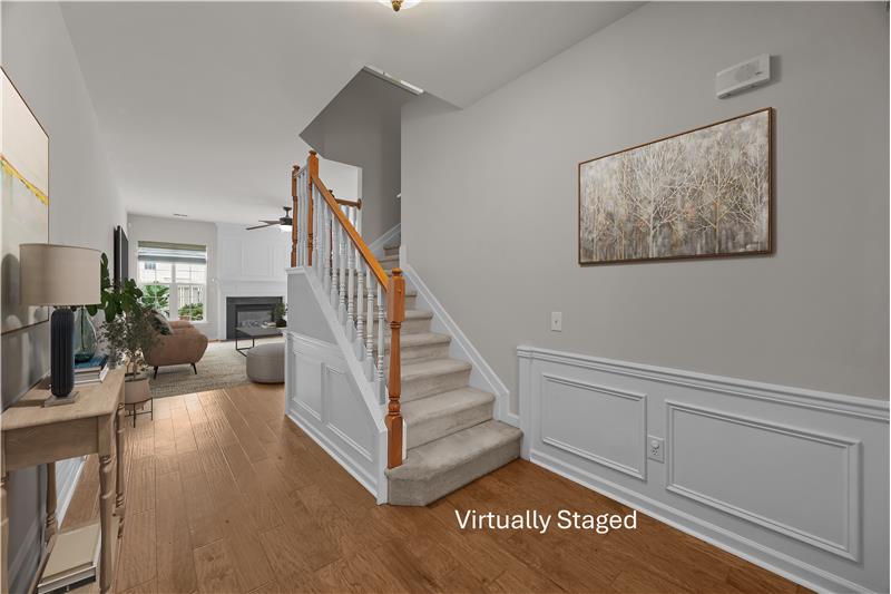 Gracious foyer with hardwood floors and detailed millwork, a welcoming introduction to the home.