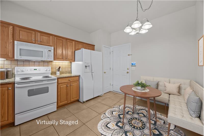 Eat-in kitchen provides space for casual meals, uncommon in many townhomes.