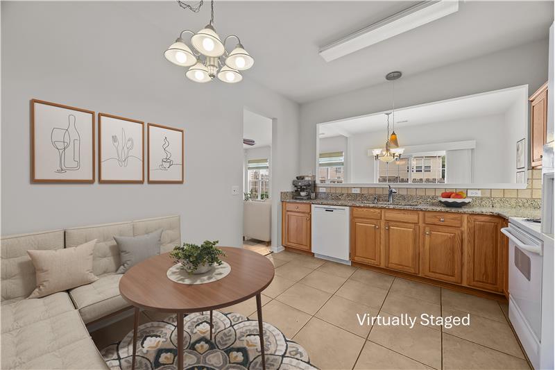 Well-designed layout combines counter space and storage with a comfortable eat-in area.