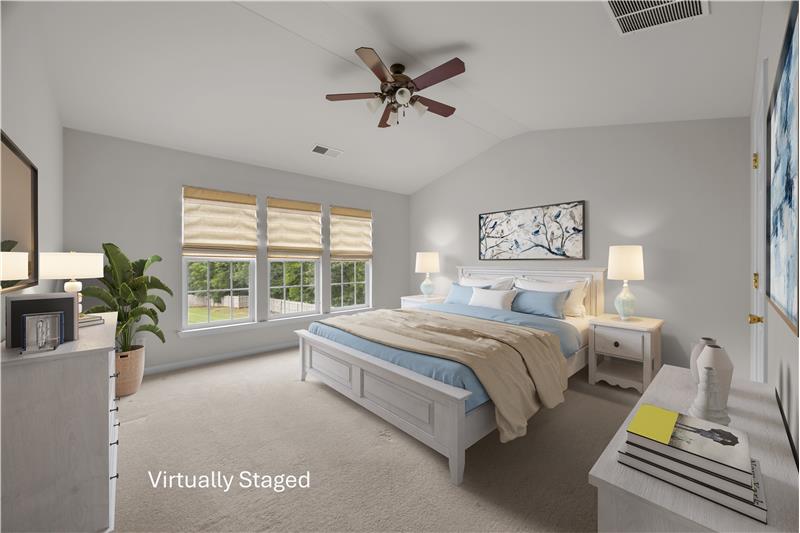 Primary suite offers generous space for furnishings and a comfortable, restful setting.