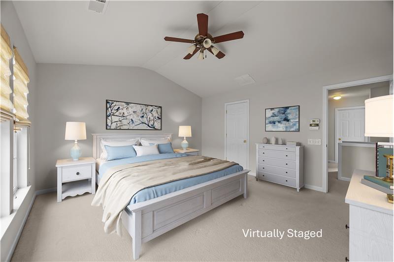 Primary bedroom  bedroom accommodates furnishings with ease and includes an en-suite bathroom.