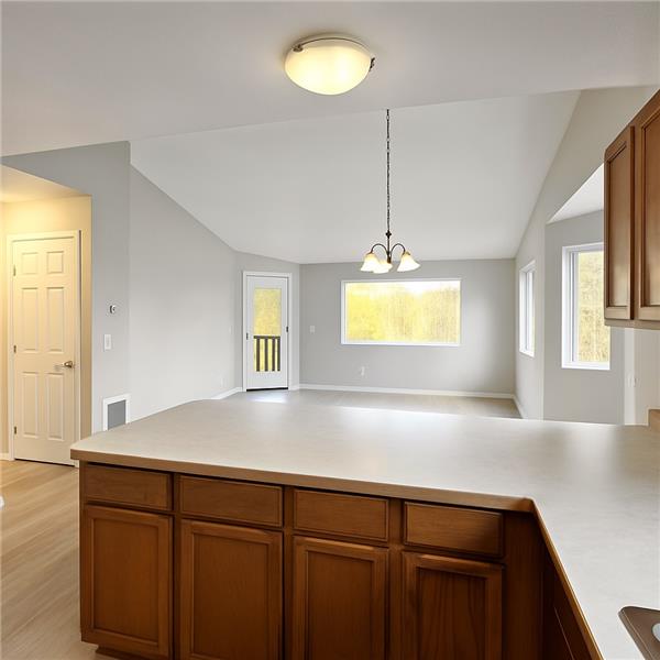 Kitchen overlooking dining to living room