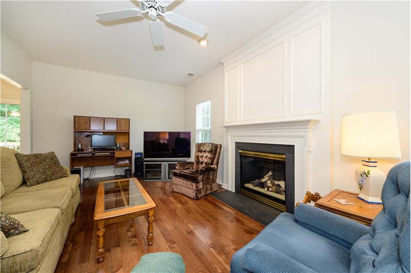 Family room with gas log fireplace.