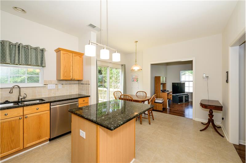 Kitchen with porcelain tile floors.