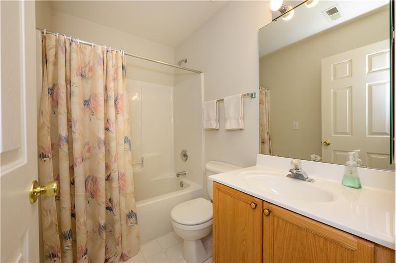 Hall bathroom shared by secondary bedrooms.