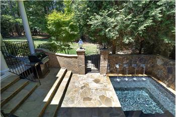 Off of the Covered Porch and Primary Suite  - Beautiful Built In Jacuzzi With Waterfall