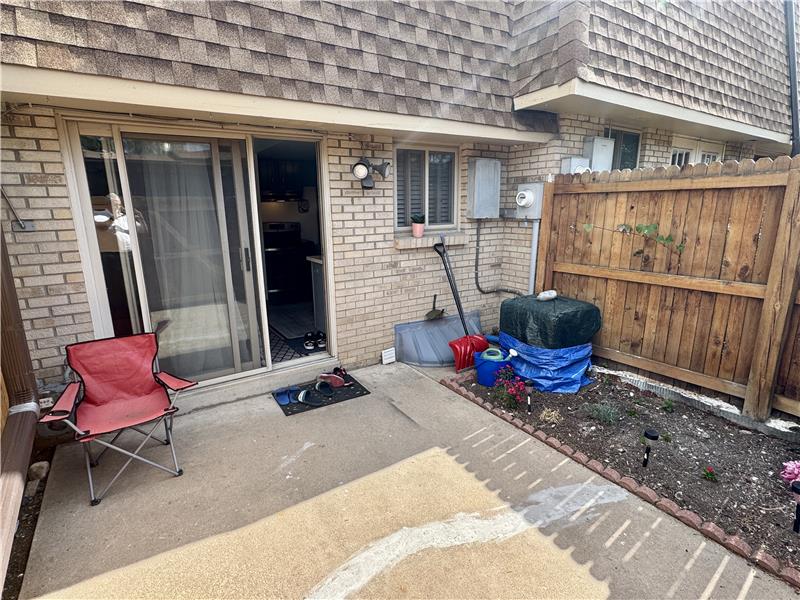 View of patio from door to carport