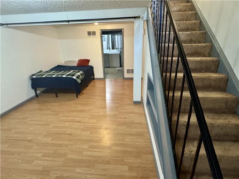 Family room in basement (used by seller as additional guest bedroom