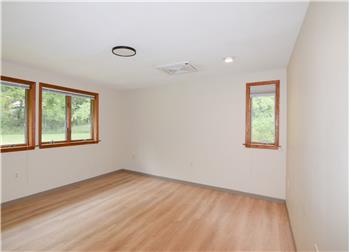 Bedroom 2  with large window facing the front yard