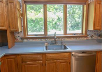 Triple window pane above the kitchen sink