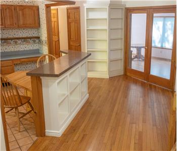 breakfast nook and small isle with storage