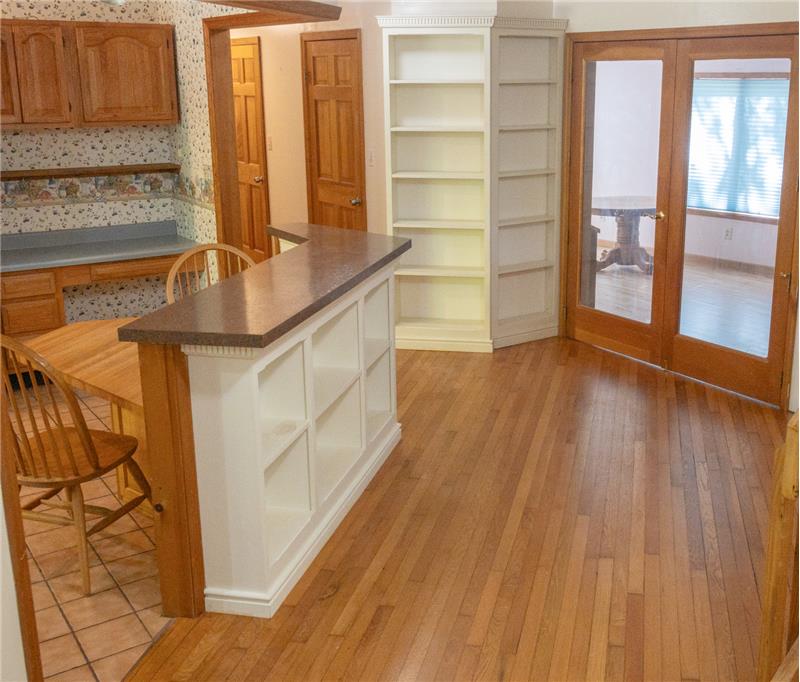 breakfast nook and small isle with storage