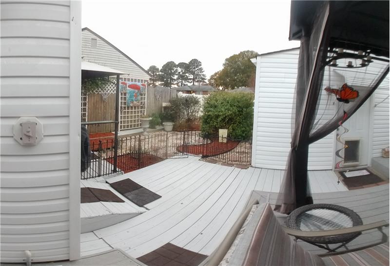Deck and Gravel, stepping stones and no grass to cut in back