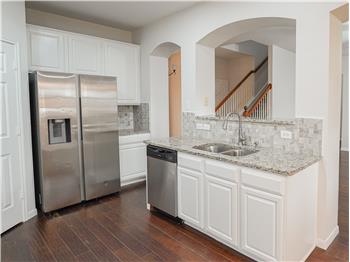 Kitchen opens to the living room