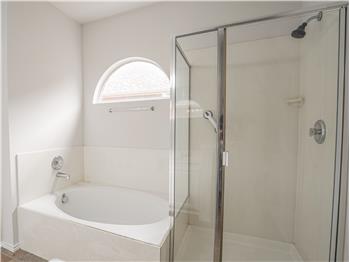 Primary bathroom with separate shower and soaking tub
