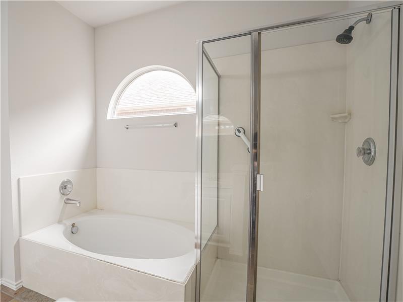 Primary bathroom with separate shower and soaking tub