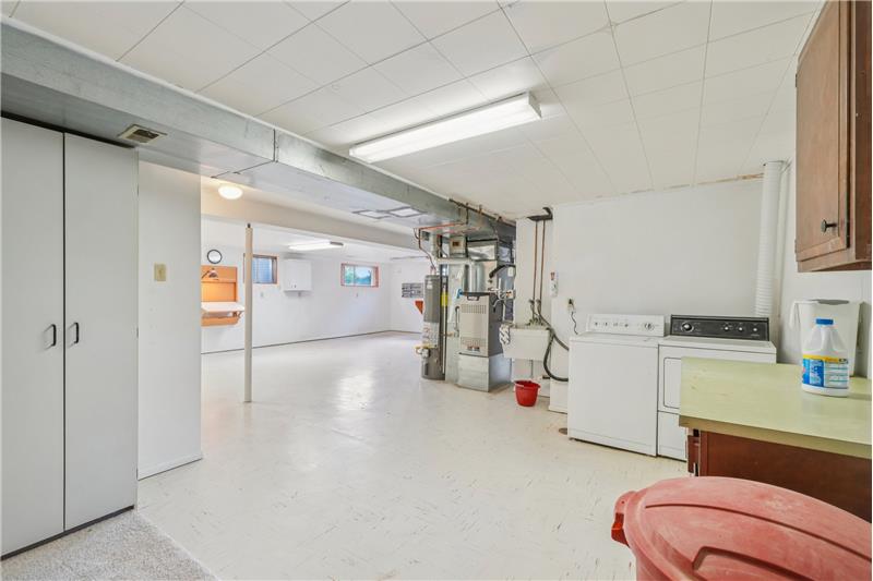 Reverse view, showing washer & dryer and more basement space