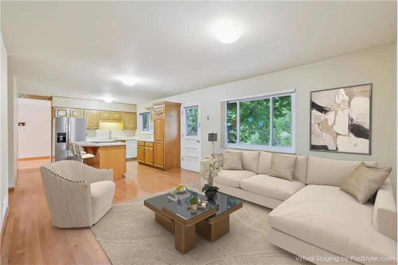 Family room open to kitchen (virtually staged)