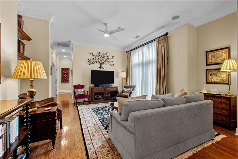 Gleaming hardwood floors, custom crown molding, 10 foot ceilings