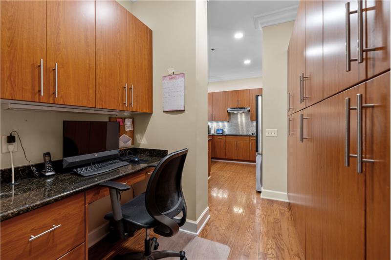 Office area situated behind the kitchen, a functional and convenient feature for today's multitasking lifestyle