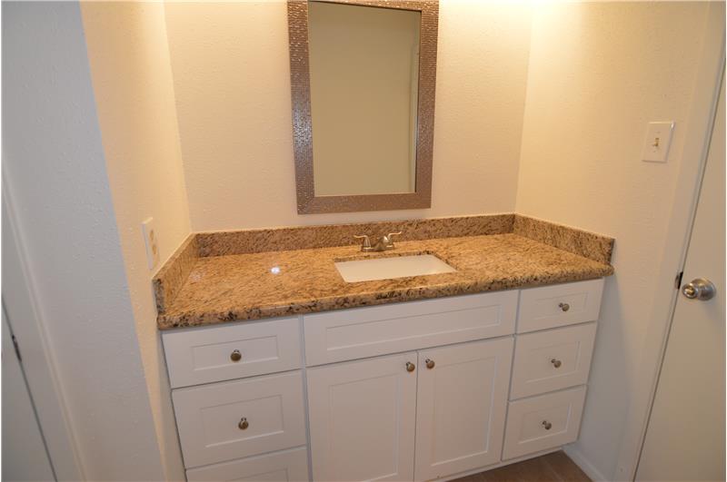 Bath Vanity with New Granite Counters and Cabinets.