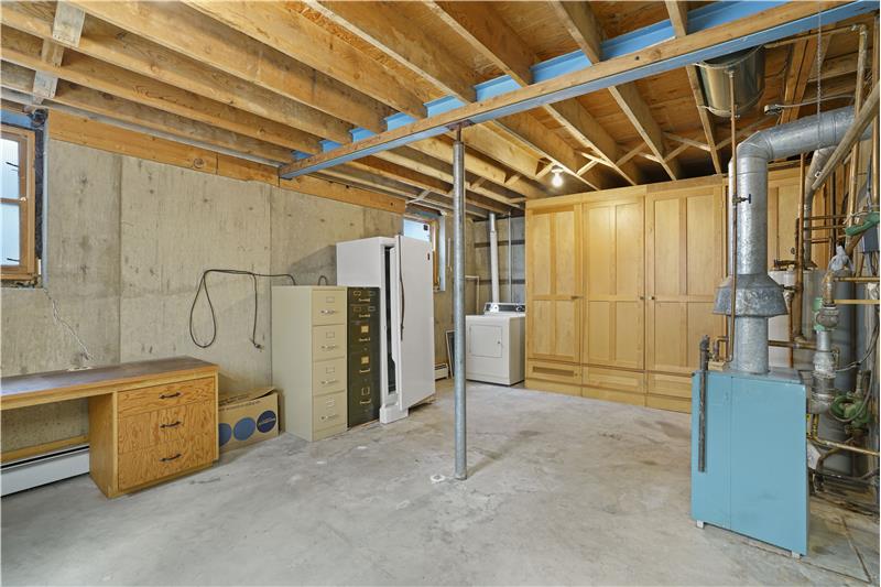 Unfinished space in basement - clothes dryer and freezer are included