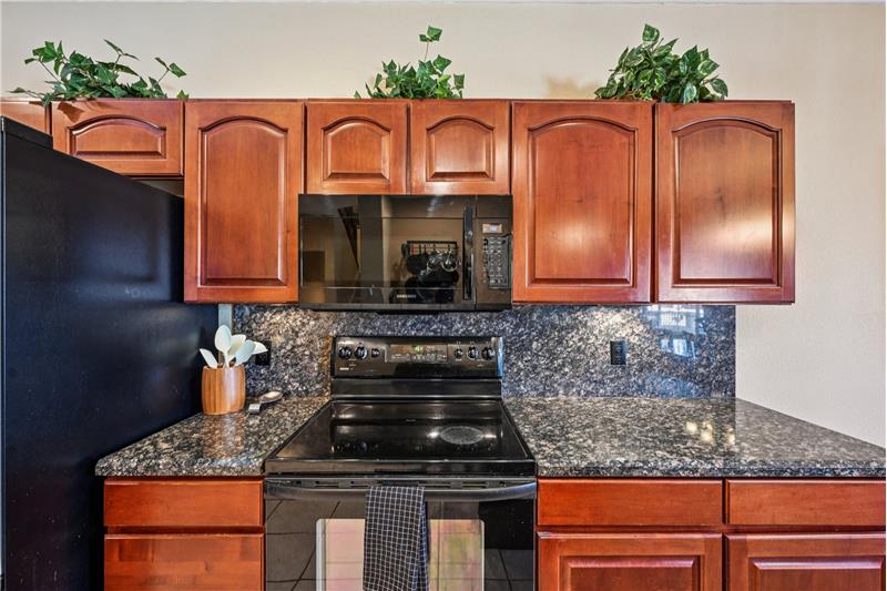 Electric glass-top range, granite countertops